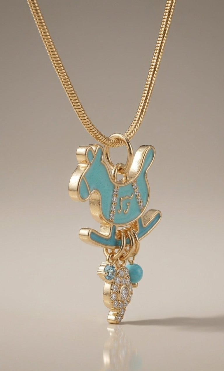 Gold necklace with a blue pendant on a neutral background